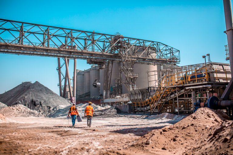 two-workers-working-with-cement-ordering-software