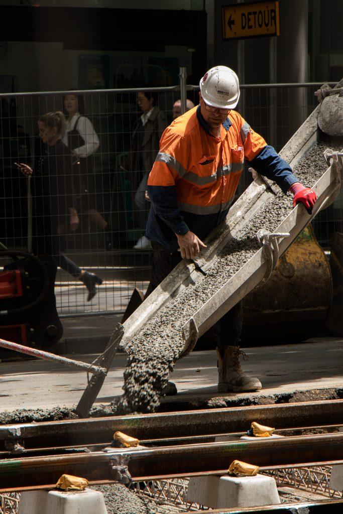 Worker-using-ready-mix-concrete-he-ordered-online